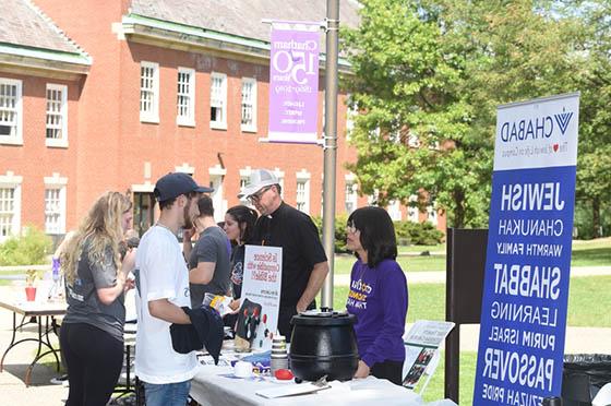 Photo of activities fair on Chatham University's 足球波胆平台, showing the Chabad House table